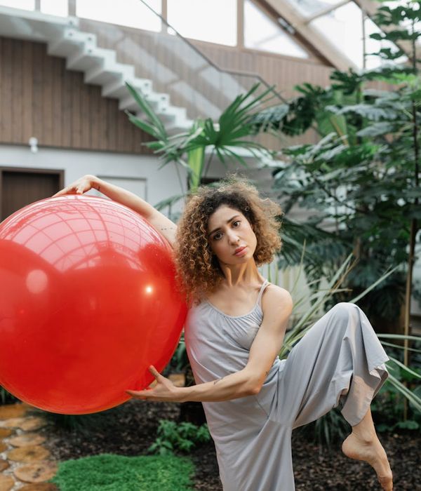 Person standing in a balanced pose showing focus and stability.